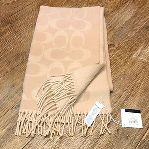 Brand new, generously sized camel-colored cashmere scarf/shawl from Coach.